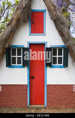 Palheiros, traditional A-framed thatched house in Funchal, Madeira Stock Photo