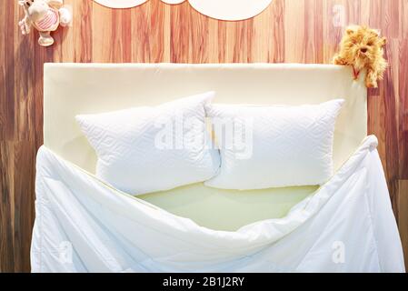 Pillows and blanket on the bed Stock Photo