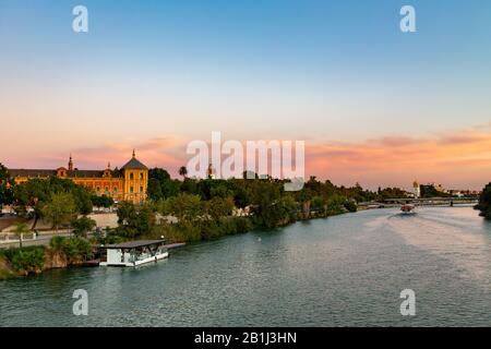 Sunset over the Guadalquivir river in Seville, Andalucia, Spain. Stock Photo