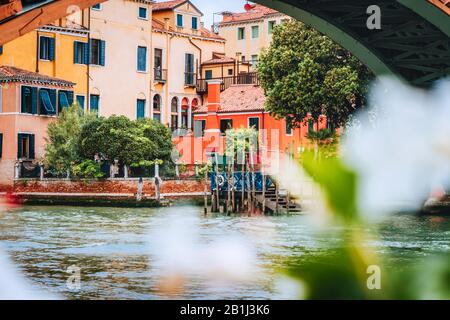 Old ancient facades of houses on Grand Canal, Venice, Italy. Vintage historical architecture buildings of Venice on water in summer season Stock Photo
