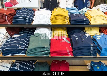Mens Polo shirts on display and on sale in a Marks and Spencer store in Truro City centre in Cornwall. Stock Photo