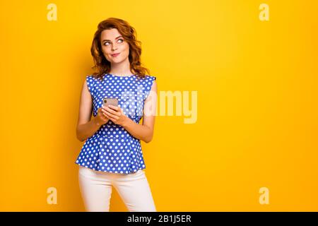 Portrait of her she nice attractive lovely creative cheerful smart clever wavy-haired girl using cell creating new smm blog idea isolated on bright Stock Photo