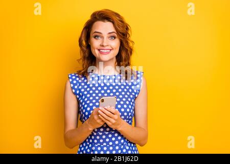 Portrait of her she nice attractive lovely pretty cheerful cheery wavy-haired girl using 5g app wireless connection web service isolated on bright Stock Photo