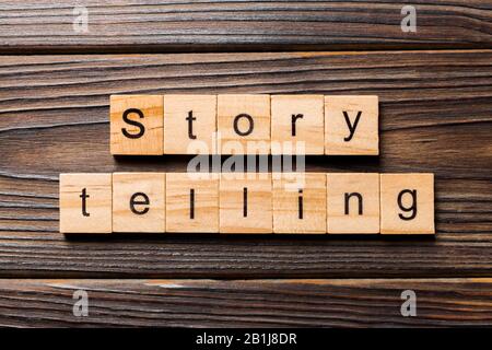 Story telling word written on wood block. Story telling text on wooden table for your desing, Top view concept. Stock Photo