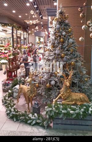 Decorated Christmas tree with deers inside a gift shop. Stock Photo