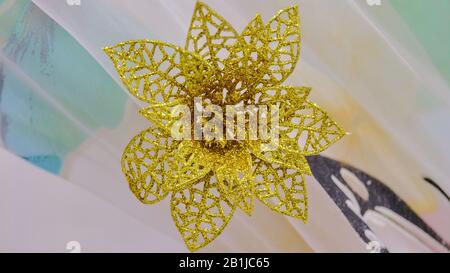 Golden decorative flower on a background of curtains Stock Photo