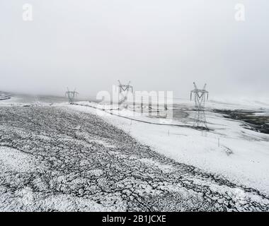 electricity pylon on a mountain which covered with snow Stock Photo - Alamy
