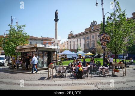 The car-free historic centre of Piacenza, with many bicycles and pedestrians. Piacenza, Italy - april 2019 Stock Photo