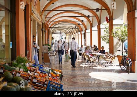 The car-free historic centre of Piacenza, with many bicycles and pedestrians. Piacenza, Italy - april 2019 Stock Photo