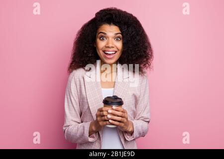 Excited crazy afro american girl economist banker rest relax hold cafeteria mug beverage look incredible sale impressed scream wow omg wear checkered Stock Photo