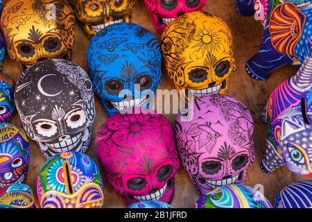 Decorated colorful skulls, ceramics death symbol at market, day of dead, Mexico. Stock Photo