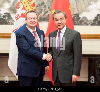 Serbian Prime Minister Ivica Dacic, right, speaks with his Croatian ...