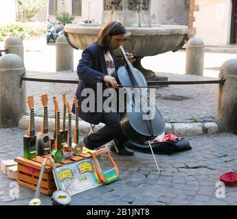 Street busker playing a cello in Rome, Italy Stock Photo