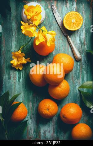 flatlay food background - empty wooden board with mint oranges and knife, with copy space for text Stock Photo
