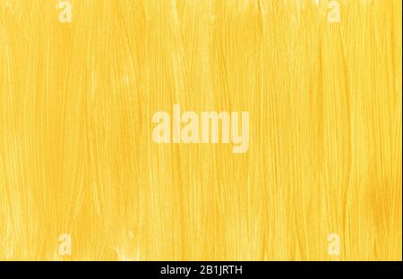 Brush strokes of gold paint, vertical stripes. Abstract modern trendy golden texture background Stock Photo