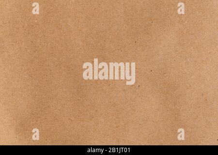 Flat lay even brown wrapping paper. Abstract trendy modern paper texture background Stock Photo