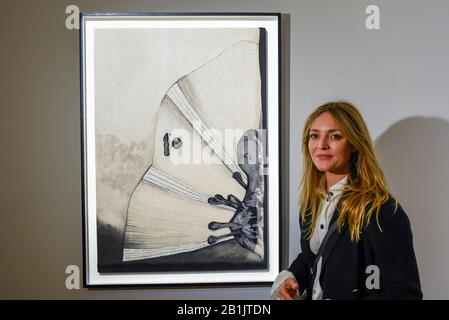 London, UK.  26 February 2020. Artist Carolina Mazzolari poses with her work called 'Void', 2019 (Starting price GBP3,000). Preview of 'Human Touch', an exhibition of one-of-a-kind artworks by international contemporary artists in collaborations with stitchers in British prisons.  In association with the charity Fine Cell Work, the artworks are on show at Sotheby's New Bond Street 26 February to 3 March 2020.  Credit: Stephen Chung / Alamy Live News