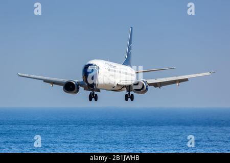 Skiathos, Greece – August 2, 2019: Blue Panorama Boeing 737-400 airplane at Skiathos airport (JSI) in Greece. Boeing is an American aircraft manufactu Stock Photo