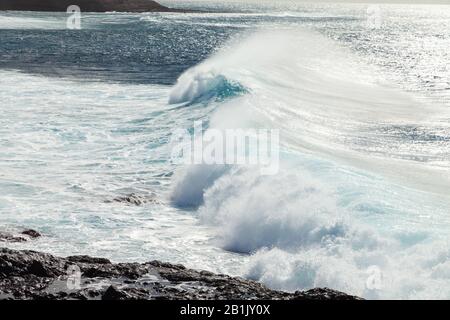 Waves breaking on the beach near Los Gigantes Tenerife. Stock Photo