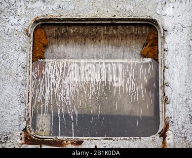 Broken window on derelict Royal Iris ferry boat Stock Photo