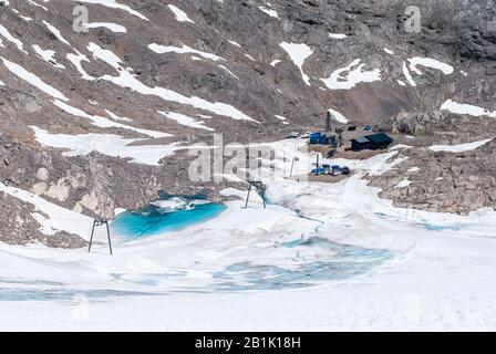 Ramsau am Dachstein, Austria – July 10, 2016. Dachstein Glacier in Austria, with buildings and skiing facilities, in summer. Stock Photo
