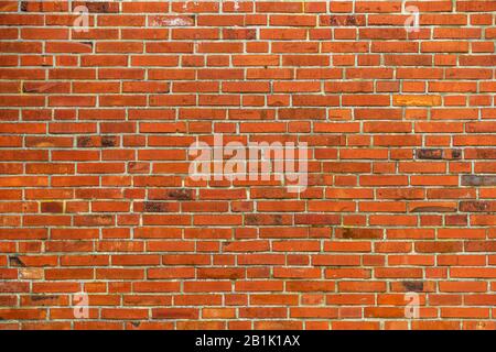 Red brickwall texture with clean lines and aged surface Stock Photo