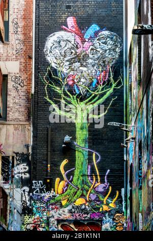 Painting of tree of life, with a large heart shaoped design, down a back alley way of graffit, Hosier Street, Melbourne Lanes, Melbourne, Victoria, Au Stock Photo