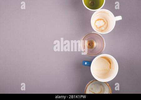 Several empty cups of coffee viewed from above on gray table. Top view layout, copy space. Stock Photo