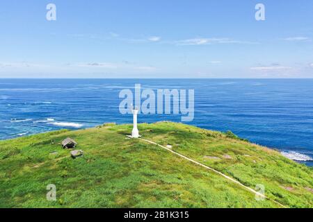 Basot Island, Caramoan, Camarines Sur, Philippines. Lighthouse on a hill by the sea, view from above . Beautiful landscape with a green island. Summer and travel vacation concept. Stock Photo