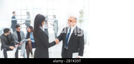 boss and the assistant discuss a business document. background in blur Stock Photo