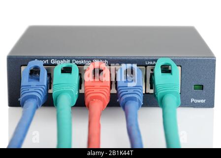 Closeup 5 port ethernet network switch with cables Stock Photo