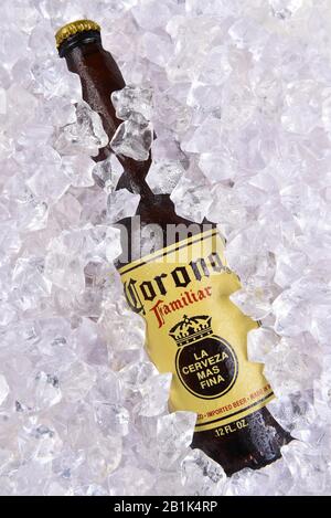 IRVINE, CALIFORNIA - MARCH 29, 2018: Closeup of a Corona Familiar beer bottle in ice. Familiar tastes like Corona Extra, but with a richer flavor. Stock Photo