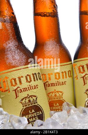 IRVINE, CALIFORNIA - MARCH 29, 2018: Closeup of three Corona Familiar beer bottles in ice. Familiar tastes like Corona Extra, but with a richer flavor Stock Photo