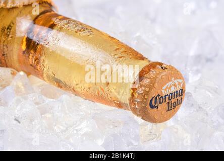 IRVINE, CALIFORNIA - DECEMBER 15, 2017: A bottle of Corona Light Beer on ice. Corona is the most popular imported beer in the USA. Stock Photo