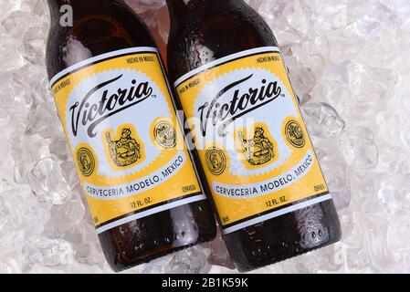 IRVINE, CALIFORNIA - MARCH 21, 2018: Two Victoria Beer bottles on ice. Mexicos oldest beer brand. Victoria has been brewed consistently as a Vienna st Stock Photo