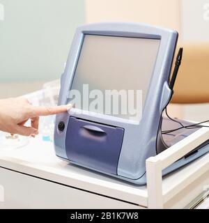 ophthalmologist doctor in exam optician laboratory with female patient. Eye care Stock Photo