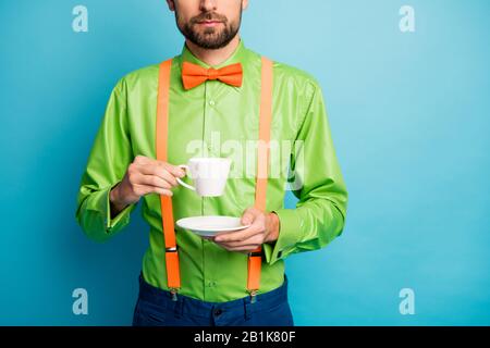 Cropped view portrait of his he nice attractive confident serious guy wearing festal shirt enjoying sweet hot cacao isolated on bright vivid shine Stock Photo