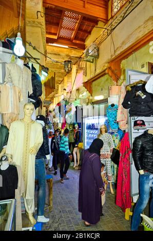 Meknes, Morocco - November 19th 2014: Unidentified people in the narrow ways of the souk with different shops Stock Photo