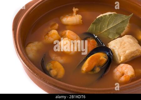 French bouillabaisse soup in bowl isolated on white background Stock Photo