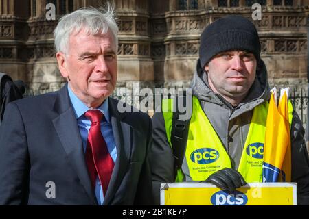 Westminster, London, UK. 26th Feb, 2020. John McDonnell, Shadow Chancellor, with a pcs rep. Labour Leader Jeremy Corbyn, as well as John Mc Donnell, Dawn Butler, and Labour Chairman Ian Lavery and others speak at a protest organised by the PCS (Public and Commercial Services Union) supporting striking Interserve Workers. Outsourced facilities management workers at the Foreign and Commonwealth Office (FCO) in London began their strike period in November, because Interserve are not willing to recognise PCS. Credit: Imageplotter/Alamy Live News Stock Photo