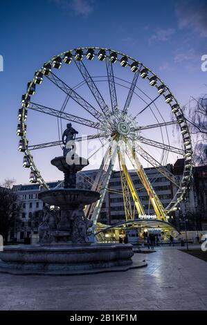 Budapest Eye ferris wheel at blue hour with Danube fountain Stock Photo ...