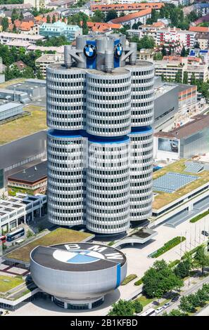 Munich, Germany – July 1, 2016. Aerial view over the BMW Headquarters building and BMW Museum in Munich. Both buildings were designed by the Austrian Stock Photo
