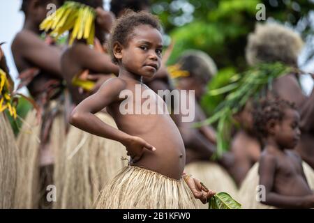 Vanuatu, South Pacific, Oceania -  Melanesian girl in traditional grass skirt portrait Stock Photo