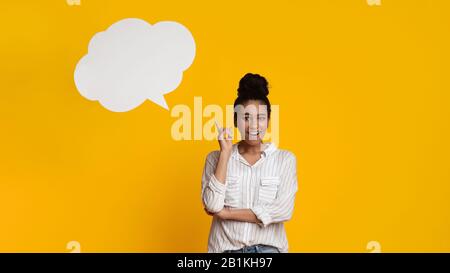 Happy Woman Having Idea, Posing With Empty Speech Bubble Above Head Stock Photo