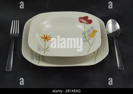 soup plate and plate with fork and spoon Stock Photo