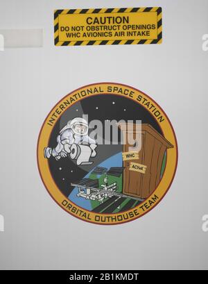 February 25, 2020, Houston, Texas, USA: A decal identifies the toilet facility in Node 3 of the International Space Station (ISS) at NASA's sprawling Johnson Space Center outside Houston.  The building houses a full size mockup of the ISS and is constantly being modified as changes are made to the current ISS that's been in space for 20-plus years. (Credit Image: © Bob Daemmrich/ZUMA Wire) Stock Photo