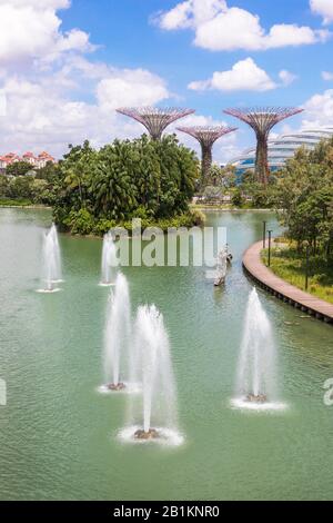 Water fountains in the Gardens on the Bay, Singapore with the supertree grove and cooler conservatory in the background, Singapore, Asia Stock Photo