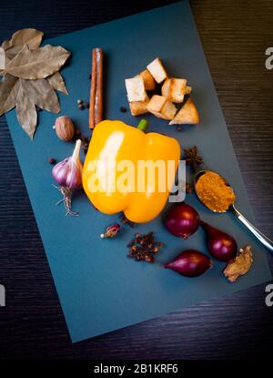 Still life with spices and vegetables on a blue background Stock Photo