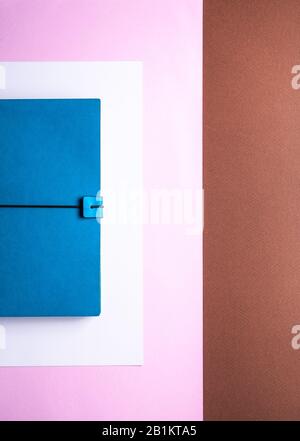lifestyle for business stationery and education concept with a closeup image of a vintage azure notepad with blank pages or copy space on a background Stock Photo