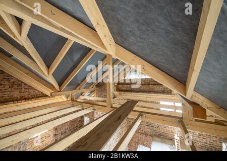 Attic space of a building under construction with wooden beams of a ...